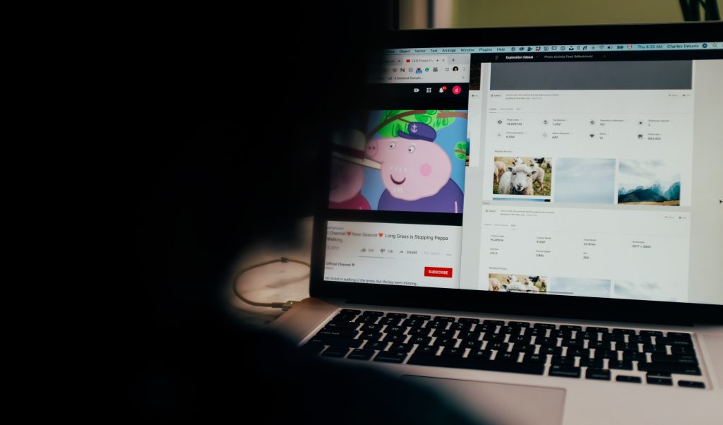 man on a laptop watching youtube